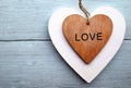 Decorative wooden hearts on a blue wooden background.Two Valentine hearts.Saint Valentine`s Day or Love concept. Royalty Free Stock Photo