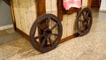 Decorative wooden wagon wheel and wagon Royalty Free Stock Photo