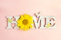 Decorative word Home with butterflies and sunflower on pink back