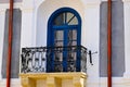 decorative wrought iron balcony balustrade. old classic building facade. white stucco elevation Royalty Free Stock Photo