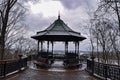 Decorative Wrought iron gazebo and bench in a park Royalty Free Stock Photo