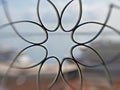 Decorative wrought iron window bar with blurry river and cruise ships behind Royalty Free Stock Photo