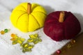 Decorative yelllow and red pumpkins made from felt