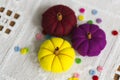 Decorative yelllow, violet and red pumpkins made from felt