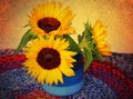 Decorative yellow sunflowers in a rustic blue ceramic pot on a multicolor knitted tablecloth. Still life. Old paper texture Royalty Free Stock Photo