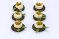 Decoreted cheese appetizers on rye bread Royalty Free Stock Photo