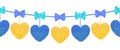 Decortive elements with pom-poms in the shape of a heart and bows Royalty Free Stock Photo