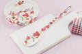 Decoupage decorated kitchen tools with flower pattern