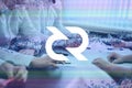 Decred, DCR cryptocurrency sign. The concept of business, cryptocurrency and finance - a team of businessmen are sitting in an