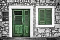 Decrepit green door and window on the Dalmatian house