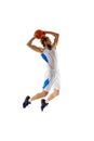 Dedicated athlete, basketball player practicing techniques, training isolated on white background. Slam dunk pose