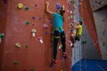 Dedicated athletes climbing wall in club Royalty Free Stock Photo