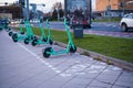 Dedicated electric scooter parking spot on city sidewalk