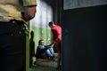 Dedicated female attorney visiting a young inmate in an obsolete prison cell Royalty Free Stock Photo