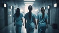 Dedicated Female Nurses in Action: A Vital Hospital Hallway Scene