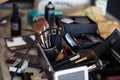 Dedicated focus Make-up converter on makeup artist\'s table with lots of makeup Royalty Free Stock Photo
