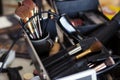 Dedicated focus Make-up converter on makeup artist's table with lots of makeup Royalty Free Stock Photo
