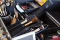 Dedicated focus Make-up converter on makeup artist\'s table with lots of makeup artist tools. Royalty Free Stock Photo