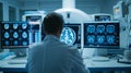 A dedicated male doctor closely examines brain scans on screens in MRI control room