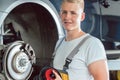 Dedicated mechanic working in a modern automobile repair shop wi