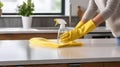 Dedicated Woman Cleaning Countertop with Disinfectant Spray AI Generated Royalty Free Stock Photo