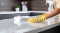 Dedicated Woman Cleaning Countertop with Disinfectant Spray AI Generated Royalty Free Stock Photo
