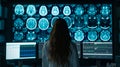 A dedicated woman doctor examines intricate body scans on multiple digital screens in futuristic lab