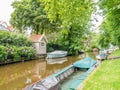 Canal with boats in old town of Broek in Waterland, Netherlands Royalty Free Stock Photo