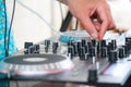 Deejay hand on equipment deck Royalty Free Stock Photo