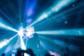 Deejay on a stage with disco ball with rays background