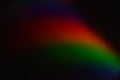 Deep abstract rainbow arc emerging from darkness Royalty Free Stock Photo