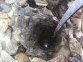 Deep ancient chinese well made of stones with no concrete Royalty Free Stock Photo