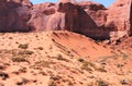 Iron oxide cross bedded sandstone cliffs overlook crescent dune below Royalty Free Stock Photo