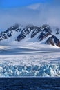 Deep Blue Glacier and Snowcapped Mountains, Arctic Royalty Free Stock Photo