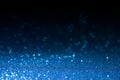 Deep blue glitter magic background. Defocused light and free focused place for your design.