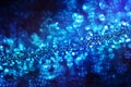 Deep blue glitter magic background. Defocused light and free focused place for your design.