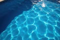 Deep blue pool water, dramatic rip, swirling effect, turbulence, movement Royalty Free Stock Photo