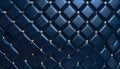 Deep blue quilted leather texture with gold studs arranged in a Royalty Free Stock Photo