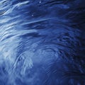 Deep blue rippling water surface capturing fluid movement and reflections Royalty Free Stock Photo
