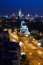 Deep blue saturated night sky with nightlights in the city panorama. Illuminated buildings and Silhouette of town. Moscow, Russia