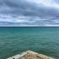 Deep blue sea meets stormy sky Royalty Free Stock Photo