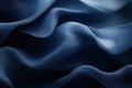 Deep blue silk fabric folds softly in elegant minimalist flowing composition Royalty Free Stock Photo