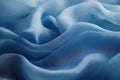 Deep blue silk fabric folds softly in elegant minimalist flowing composition Royalty Free Stock Photo