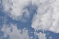 Deep blue sky background with white puffy & fluffy cumulus or cumulonimbus cloud
