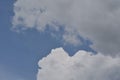 Deep blue sky background with white puffy & fluffy cumulus or cumulonimbus cloud in tropical summer climate weather Royalty Free Stock Photo