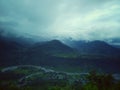 Deep blue sky with dense cloud surrounded by high mountain Royalty Free Stock Photo