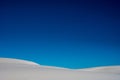 Deep Blue Sky Fills The Frame With White Sands Below