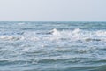 Deep blue stormy sea water surface with foam and waves pattern, natural background Royalty Free Stock Photo