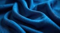 Deep blue textile draped in soft, luxurious waves, showing intricate texture and subtle light reflections. Generative AI Royalty Free Stock Photo