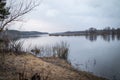 Deep calm river in the spring evening against a cloudy sky Royalty Free Stock Photo